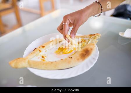 Abkhazia khachapuri three yolk quail eggs in still life on a plate in cafe Stock Photo