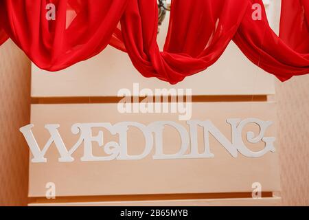 Wedding decorated for banquet in red style presidium table for bride and groom Stock Photo