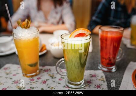 Closeup of three creative sweet exotic alcoholic party cocktails in restaurant at bar background Stock Photo