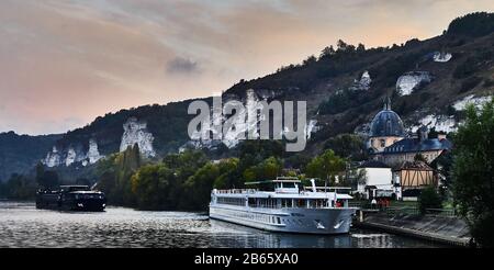 The Botticelli Cruise Ferry along River Seine at sunrise in the town of Les Andelys , on the river La Seine Stock Photo