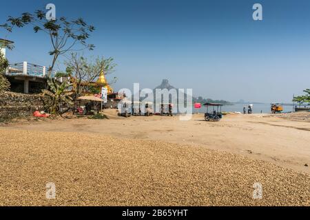 Drying of peanuts in the street, Hpa-An, Myanmar, Asia Stock Photo