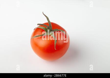Close-Up Of Tomato Against White Background Stock Photo