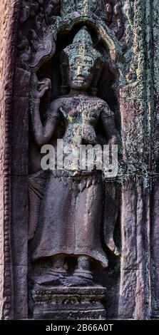 Cambodia-Angkor Ta ProhmSandstone sculpture of Apsara Devata. An Apsara or Apsarasa is a female spirit of the clouds and waters in Hindu and Buddhist mythology. Deva is the Hindu term for deity, devatas are a kind of smaller more focused devas Stock Photo