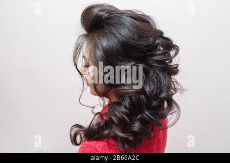 evening hair styling Brunette, back view Stock Photo