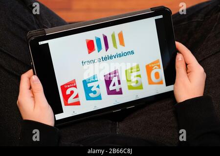 Bordeaux , Aquitaine / France - 11 30 2019 : France Television group on screen tablet woman touch pad watch french tv Stock Photo