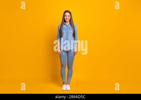 Full size photo of cute sweet nice girl enjoy spring holiday free time stand look lovely wear stylish millennial clothing footwear isolated over Stock Photo