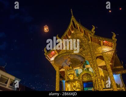Sky lanterns at Wat Phra Singh temple during Yee Peng festival in Chiang Mai Thailand Stock Photo