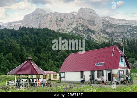14 July 2016, FISHT CAMPING SHELTER, Lago-Naki plateau, ADYGEA REPUBLIC, RUSSIA: Tourist shelter with houses in Caucasian mountains Stock Photo