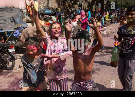 New Delhi, India. 10th Mar, 2020. Indian children smeared with colours celebrate the festival of Holi in New Delhi, India, March 10, 2020. The Hindu festival of Holi, or the Festival of Colors, heralds the arrival of spring. Credit: Javed Dar/Xinhua/Alamy Live News Stock Photo