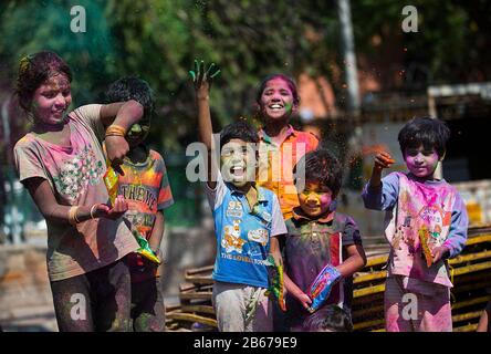 New Delhi, India. 10th Mar, 2020. Indian children smeared with colours celebrate the festival of Holi in New Delhi, India, March 10, 2020. The Hindu festival of Holi, or the Festival of Colors, heralds the arrival of spring. Credit: Javed Dar/Xinhua/Alamy Live News Stock Photo