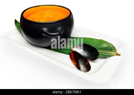 popular Thai Tom Yum Kung with mussel shell isolated on white Stock Photo