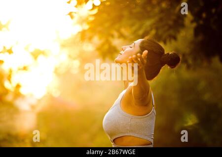Beautiful woman exercising at park Stock Photo