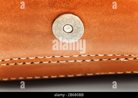 Cloesup of a leather handbag with a belt buckle Stock Photo