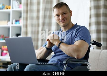 Cheerful man using computer Stock Photo