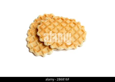 Two golden round waffles isolated over white background. Stock Photo