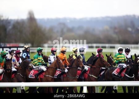A general view of runners and riders ahead of the opening race of the Cheltenham Festival at Cheltenham Racecourse, Cheltenham. Stock Photo