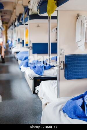 09 SEPTEMBER 2017, UFA, BASHKORTOSTAN: Interior of a typical russian long-distance RZD train with beds for sleeping Stock Photo