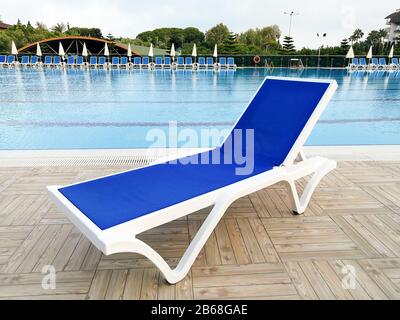 Plastic sun lounger near the swiming pool holidays concept Stock Photo Alamy