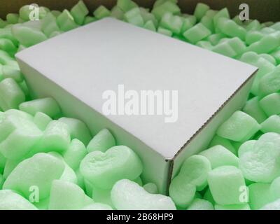 Loose fillers many soft chips in the parcel box for professional shippment protection Stock Photo