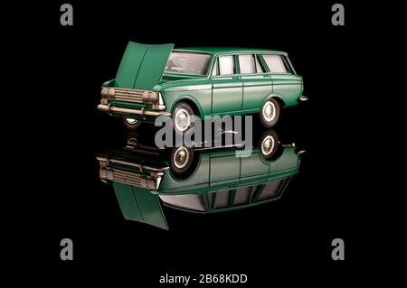 Green soviet car die cast model on the black reflective background Stock Photo