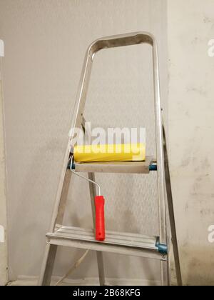 Renovation wallpaper gluing tools and other equipment in flat under construction Stock Photo