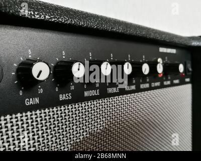 Guitar combo amplifier control knobs close up Stock Photo