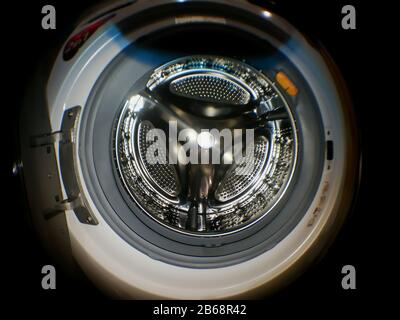 Washing machine drum with many holes internal view Stock Photo