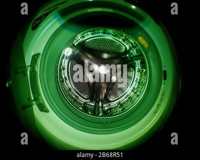 Washing machine drum with many holes internal view Stock Photo