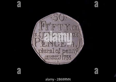 Commemorative 50 pence UK coin with english dictionary symbolic Stock Photo