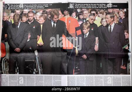 Princess Diana's brother Earl Spencer comforts Prince Harry, Prince William standing in reverence at funeral Guardian newspaper London England UK 1997 Stock Photo