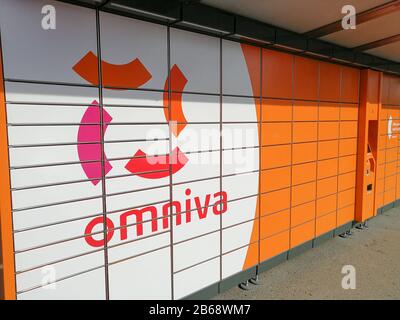 KAUNAS, LITHUANIA - JUNE 26, 2018: Omniva terminal for automatic parcel delivery with many drawers for parcels Stock Photo