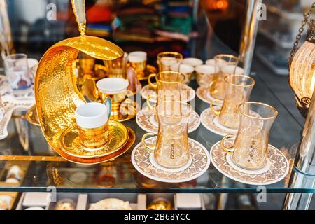 Traditional handmade tea and coffee sets or teapots for sale at the bazar souvenir market in Istanbul, Turkey Stock Photo