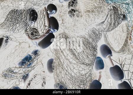 Inverted black and white image of commercial fish nets and ropes, Fishermen's Terminal, Seattle, Washington Stock Photo