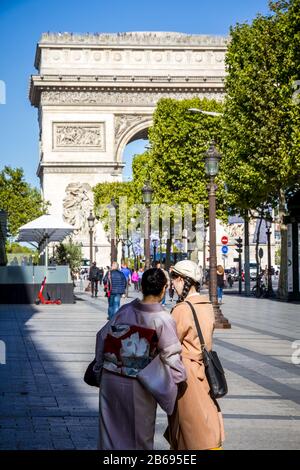 Asian Tourist Girl With A Louis Vuitton Shopping Bag On Champselysees  Avenue Stock Photo - Download Image Now - iStock