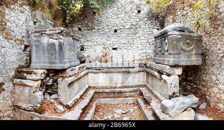 Olympos is an ancient greek town on a mediterranean shore, large historical, archaeological and tourist attraction in Turkey, Chirali Stock Photo