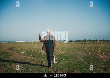 ESSAOUIRA, MOROCCO - JANUARY 17, 2020: Moroccan man, an elderly seller in the street - portrait Stock Photo