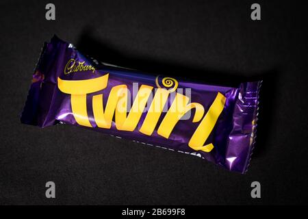 LONDON - MARCH 04, 2020: Cadbury Twirl chocolate bar on dark background Stock Photo