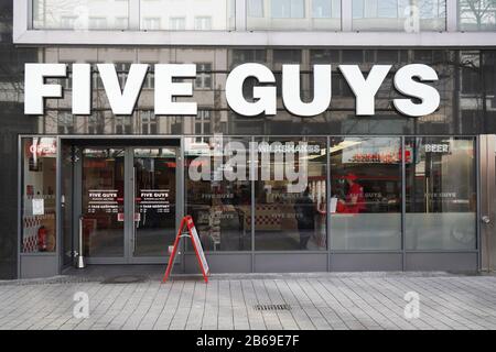 Hannover, Germany - March 2, 2020: Five Guys fast casual burger restaurant chain recently opened a local branch. Stock Photo