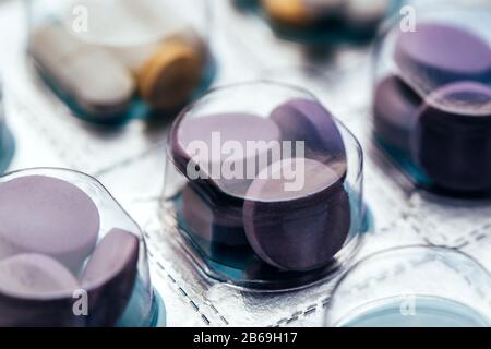Close up of pills in blisters for every day of the week for the morning, day, night time. Medications for patients in a hospital. Stock Photo