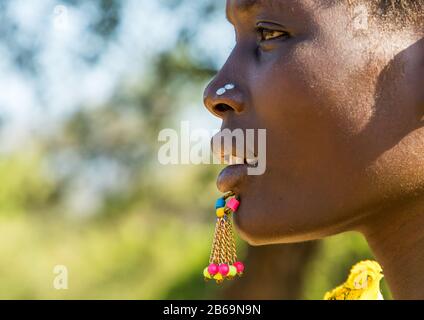 Close up of the face of a Larim tribe woman with a chin labret, Boya Mountains, Imatong, South Sudan Stock Photo