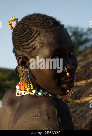 Portrait of a Larim tribe woman with traditional eaerrings, Boya Mountains, Imatong, South Sudan Stock Photo