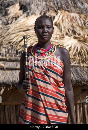 Portrait of a Larim tribe woman with a traditional stick, Boya Mountains, Imatong, South Sudan Stock Photo