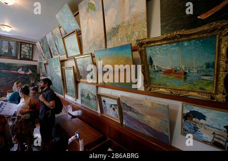 Visitors inside of the first studio of Claude Monet in Giverny in Claude Monet House and Gardens.Giverny.Region of Normandy.France Stock Photo