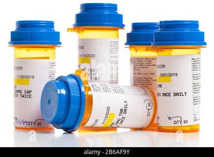 Set of prescriptions. Brown bottles and blue plastic caps on a white background Stock Photo