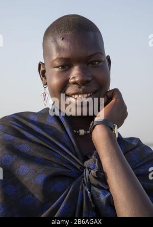 Portrait of a smiling Mundari tribe woman, Central Equatoria, Terekeka, South Sudan Stock Photo