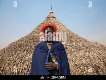 Portrait of a Mundari tribe woman in front of her hut, Central Equatoria, Terekeka, South Sudan Stock Photo