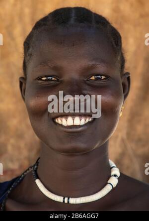 Portrait of a smiling Mundari tribe woman, Central Equatoria, Terekeka, South Sudan Stock Photo