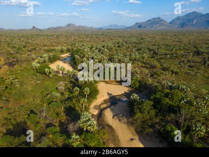 Dry river in an oasis in front of the Boya mountains, Boya Mountains, Imatong, South Sudan