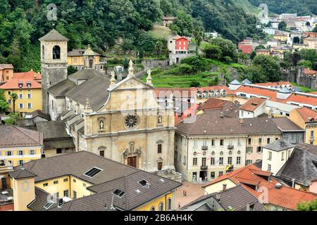 BELLINZONA, SWITZERLAND - JULY 4, 2014: The Collegiate Church and town of Bellinzona, seen from Castelgrande. The Renaissance building was built in 15 Stock Photo