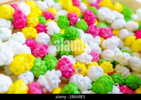 Colorful glazed nuts and candies sweets background lay flat. Stock Photo